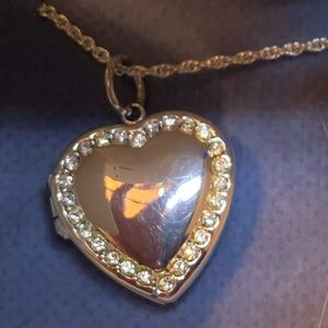 New in box silver locket by Avon years ago